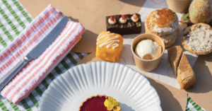 Cream tea served on the beach at Carlyon Bay by from Manor Made Cornwall