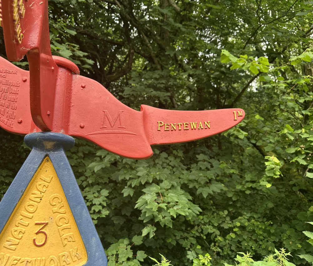 Signposts on the pentewan trail as you leave little winnick campsite to join the trail